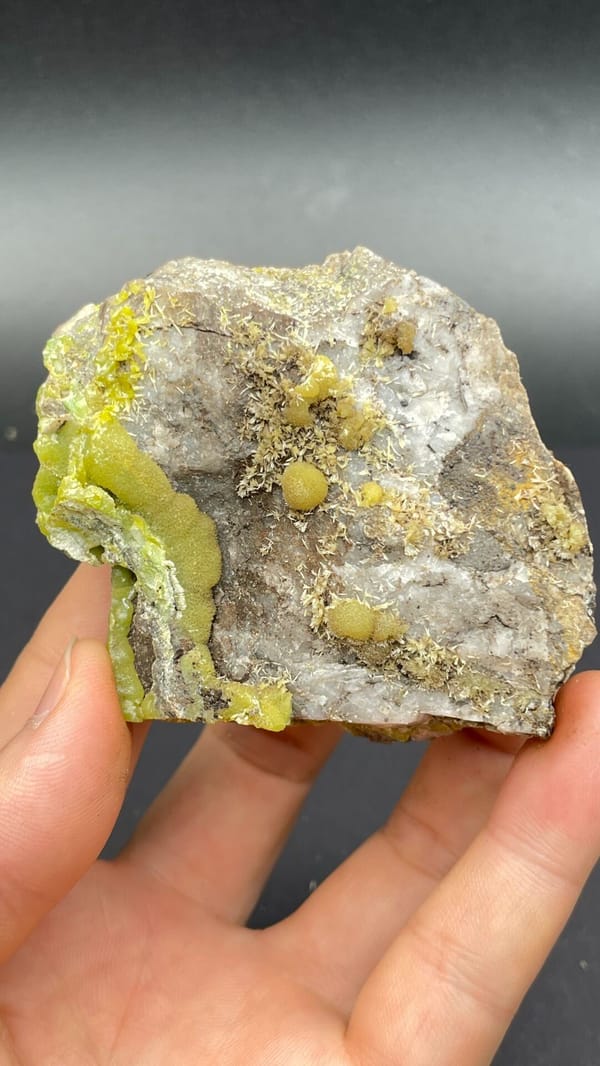 Yellow-green pyromorphite patches on a pale quartz rock from Guangdong, China
