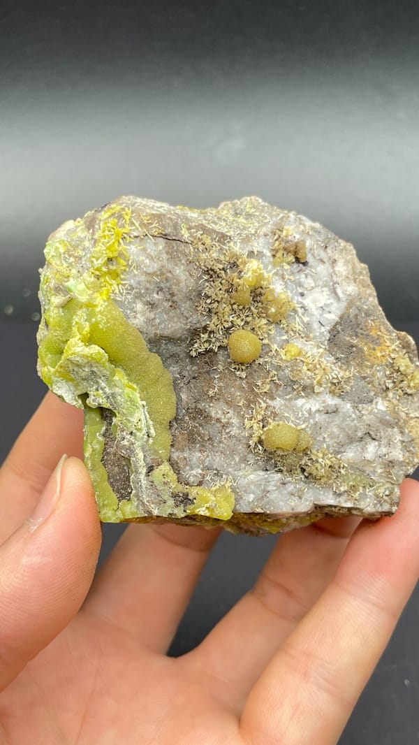 Yellow-green pyromorphite patches on a pale quartz rock from Guangdong, China, second angle