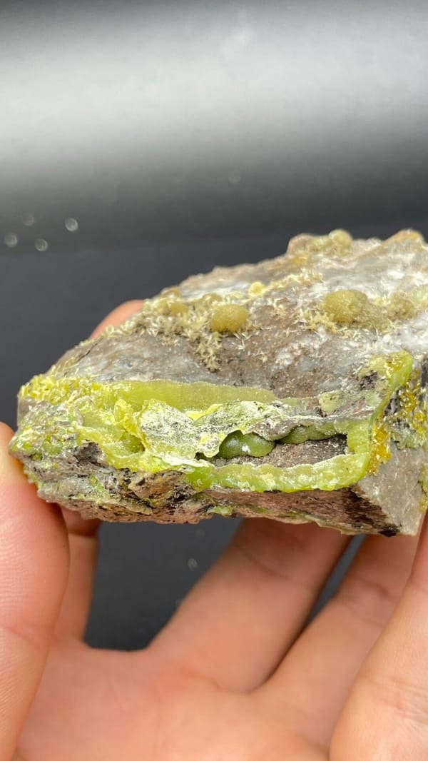 Yellow-green pyromorphite patches on a pale quartz rock from Guangdong, China, reverse side