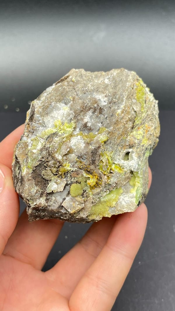 Yellow-green pyromorphite patches on a pale quartz rock from Guangdong, China, top view
