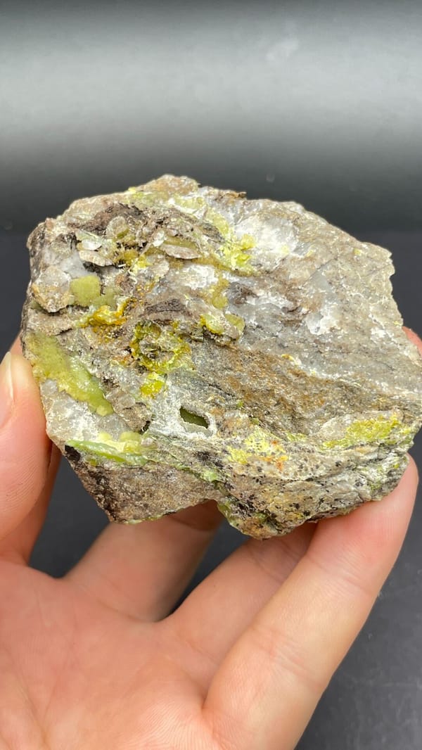 Yellow-green pyromorphite patches on a pale quartz rock from Guangdong, China, detail of the matrix contact