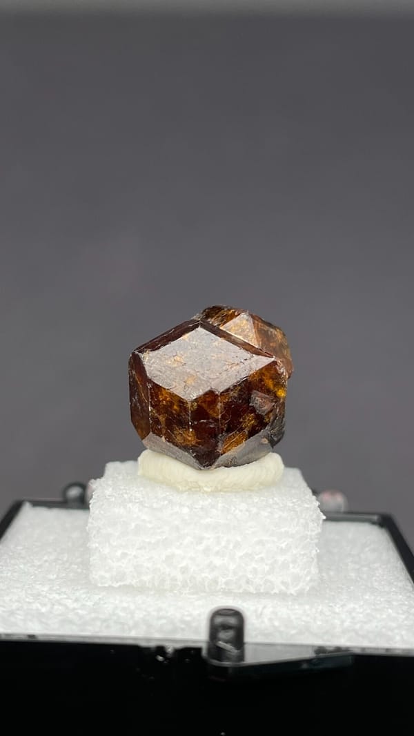 Amber-brown dodecahedral andradite garnet crystal from Handan, Hebei, China, second angle
