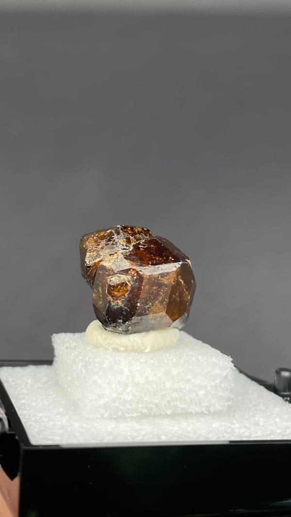 Amber-brown dodecahedral andradite garnet crystal from Handan, Hebei, China, top view