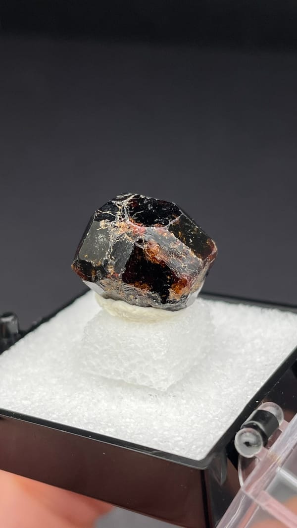 Dark brown dodecahedral andradite garnet single crystal from Handan, Hebei, China, reverse side