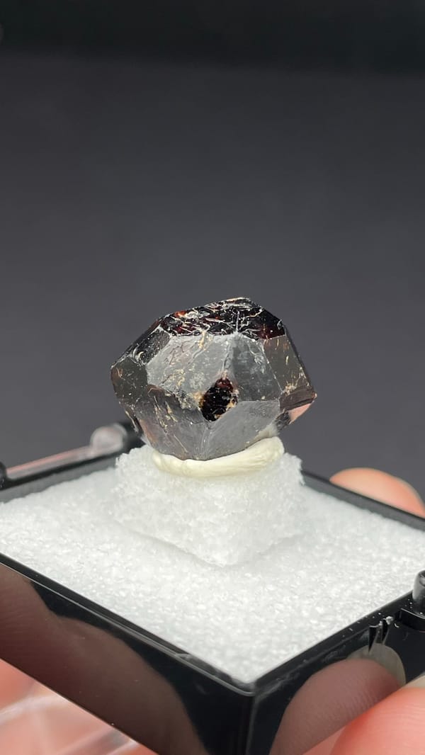 Dark brown dodecahedral andradite garnet single crystal from Handan, Hebei, China, top view