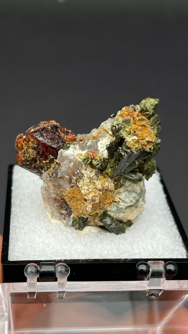 Brown garnet dodecahedra with fanned olive epidote blades, Handan, Hebei, China, reverse side
