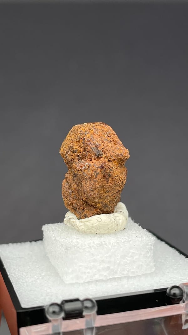 Rough orange-brown dodecahedral andradite garnet from Handan, Hebei, China, reverse side