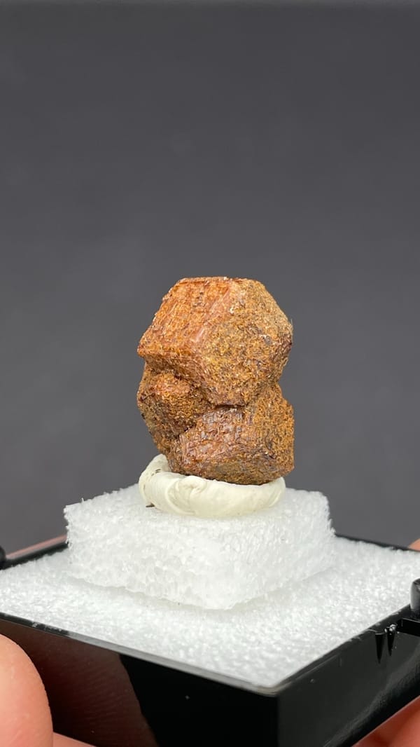 Rough orange-brown dodecahedral andradite garnet from Handan, Hebei, China, top view