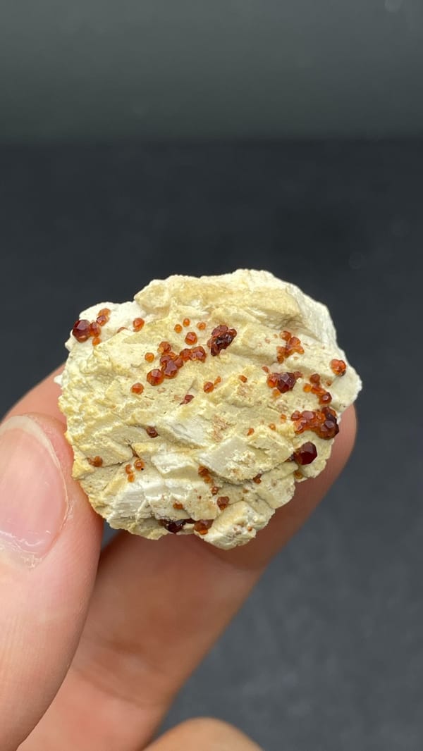 Dark red garnet crystals in cream matrix from Fujian, China, reverse side