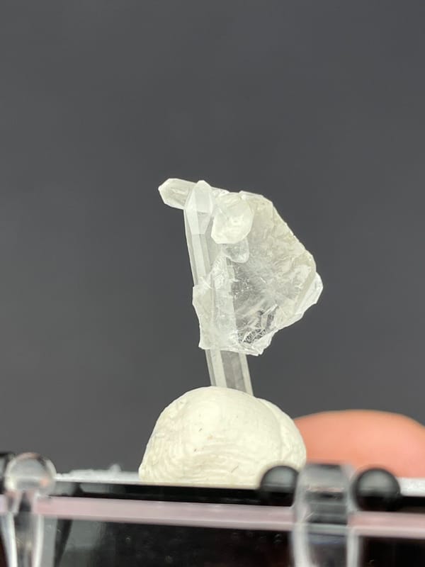 Thin white baryte blade with a quartz needle, Jinkouhe, Sichuan, China, close-up of the crystal faces