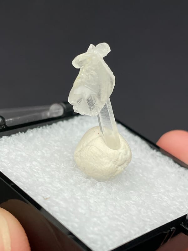 Thin white baryte blade with a quartz needle, Jinkouhe, Sichuan, China, side view