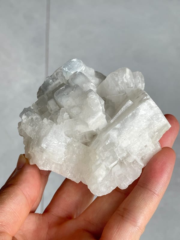 Large white-grey blocky baryte crystal group from Jinkouhe, Sichuan, China, side view