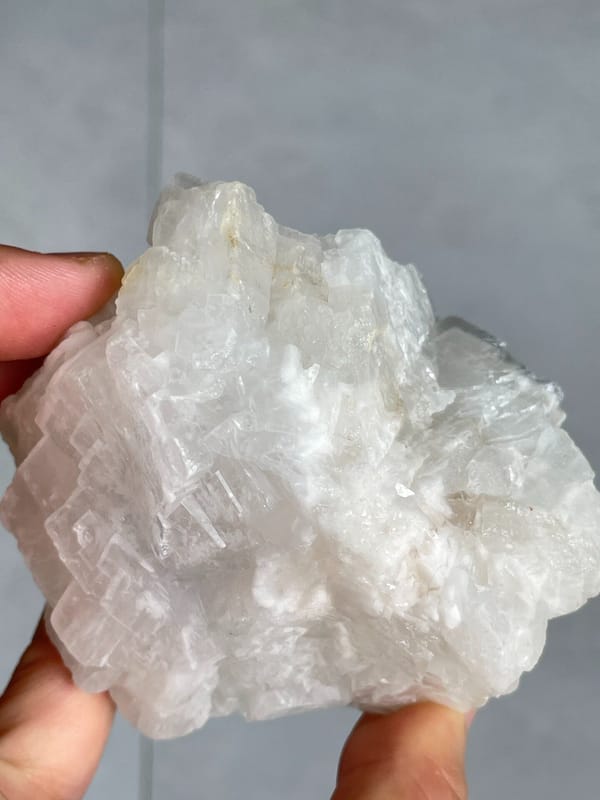 Large white-grey blocky baryte crystal group from Jinkouhe, Sichuan, China, close-up of terminations