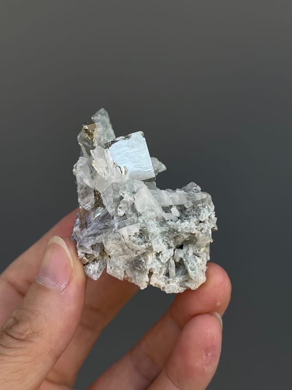 Pale metallic pyrite crystal on grey matrix from Shangbao, Hunan, China, second angle