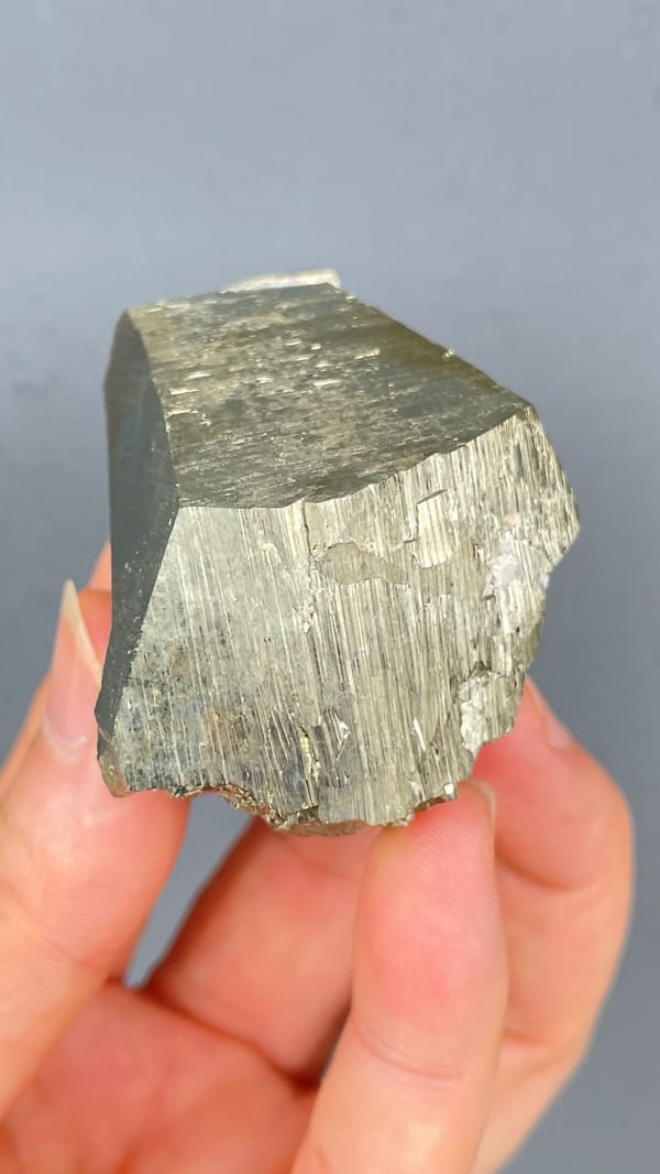 Large brassy striated pyrite single crystal from Yunnan, China, second angle