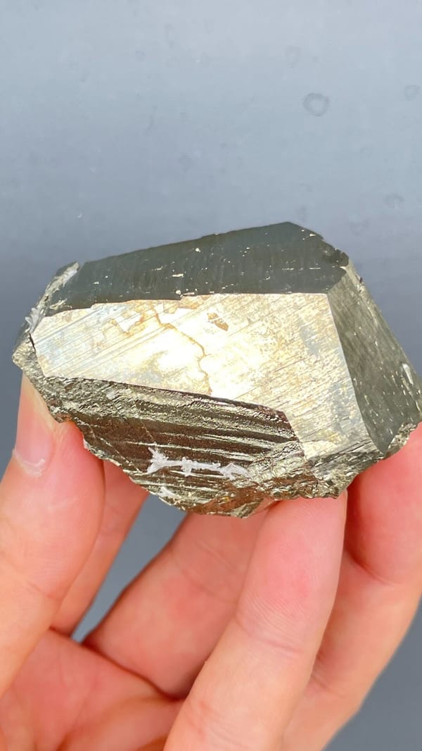 Large brassy striated pyrite single crystal from Yunnan, China, reverse side