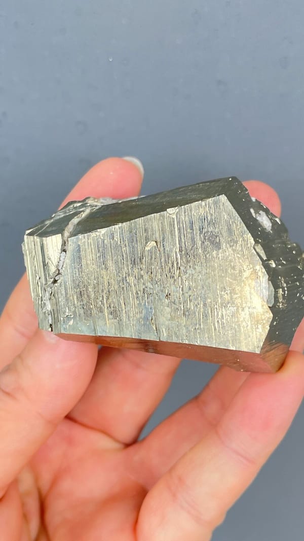 Large brassy striated pyrite single crystal from Yunnan, China, top view