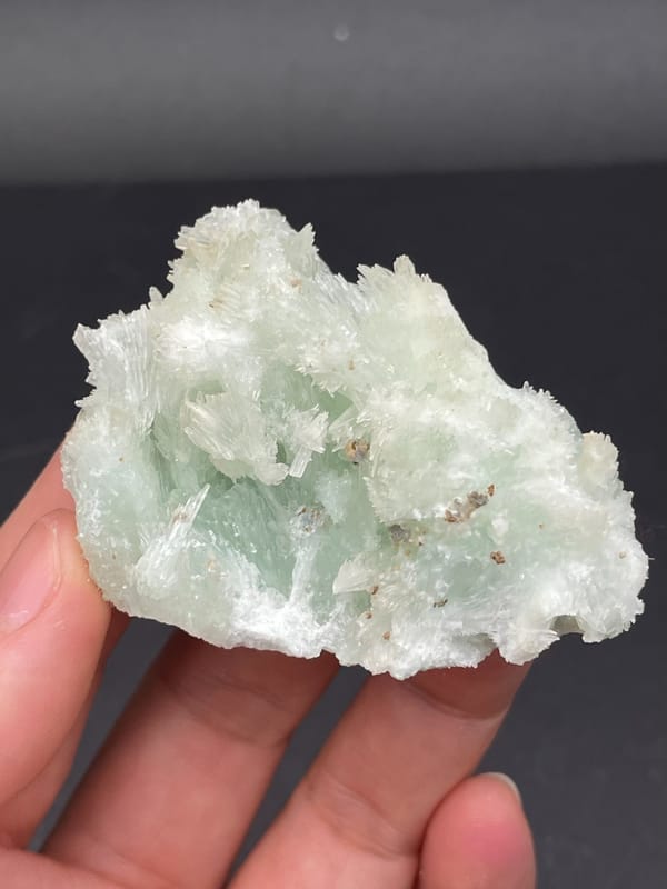 Pale blue-green bladed aragonite crust from Yunnan, China, reverse side