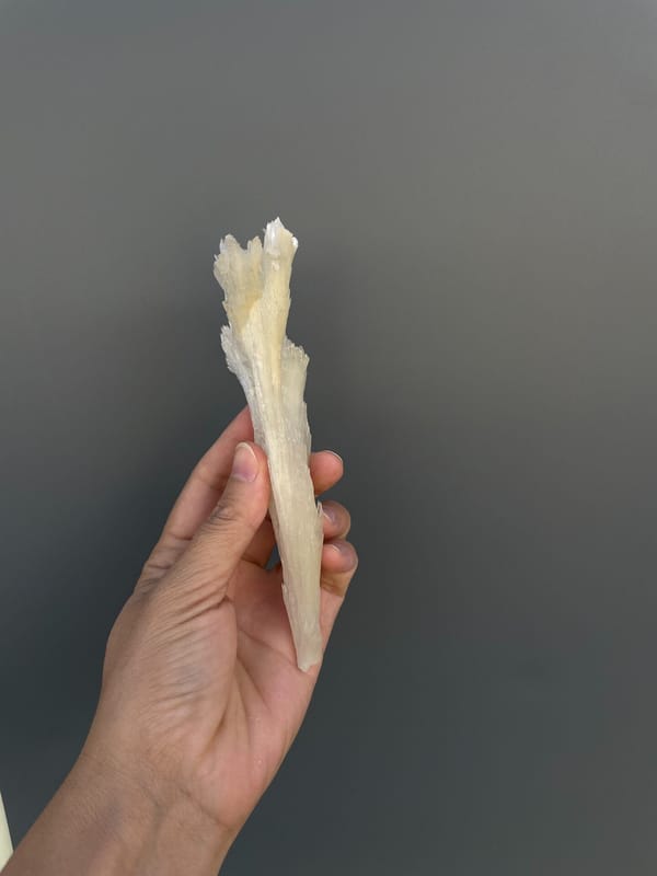 Long white fibrous aragonite fan from Guizhou, China, second angle