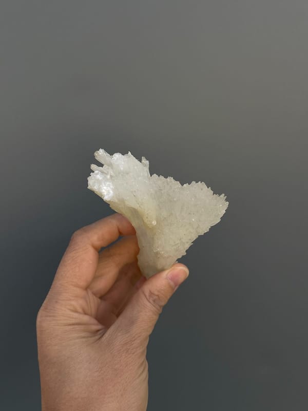 Long white fibrous aragonite fan from Guizhou, China, top view