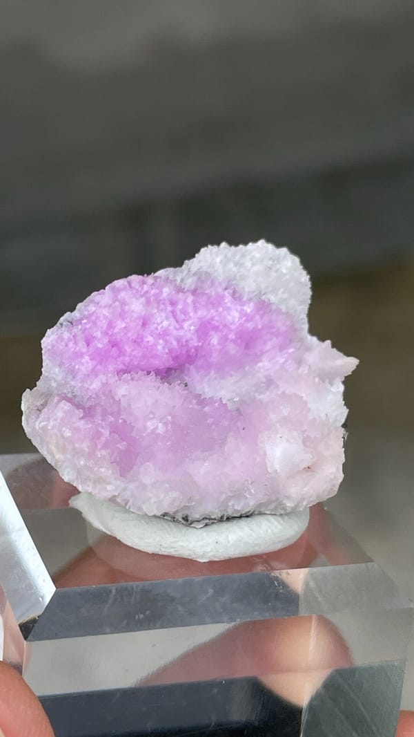 Magenta-pink aragonite cap on pale rock from Yunnan, China, second angle