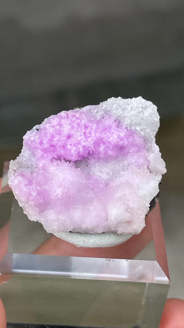 Magenta-pink aragonite cap on pale rock from Yunnan, China, top view