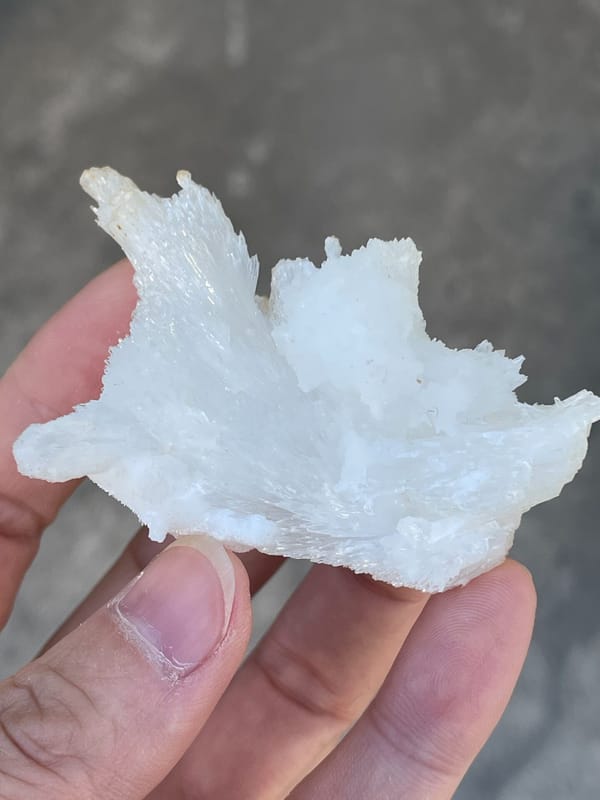 White fibrous aragonite spray from Guizhou, China, top view