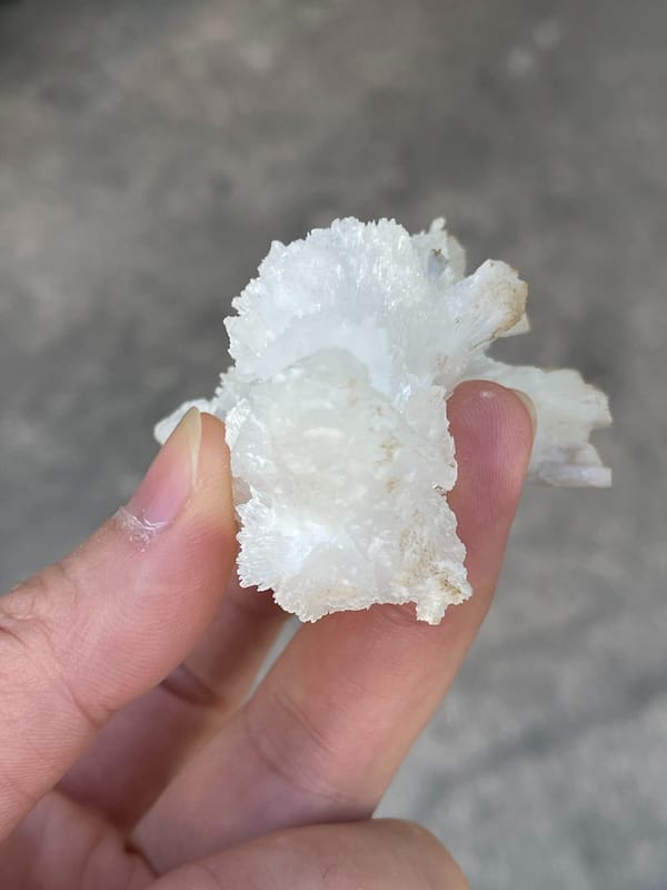 White fibrous aragonite spray from Guizhou, China, close-up of terminations