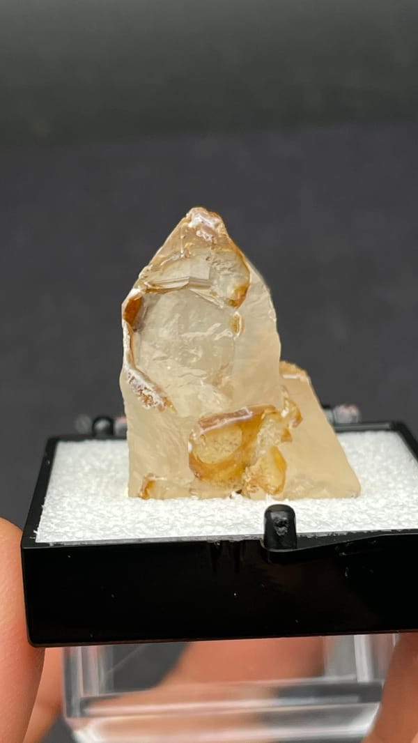 Caramel-brown frosted quartz crystal from Jinlong, Guangdong, China, in a box