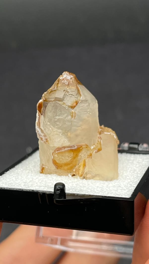 Caramel-brown frosted quartz crystal from Jinlong, Guangdong, China, in a box, second angle