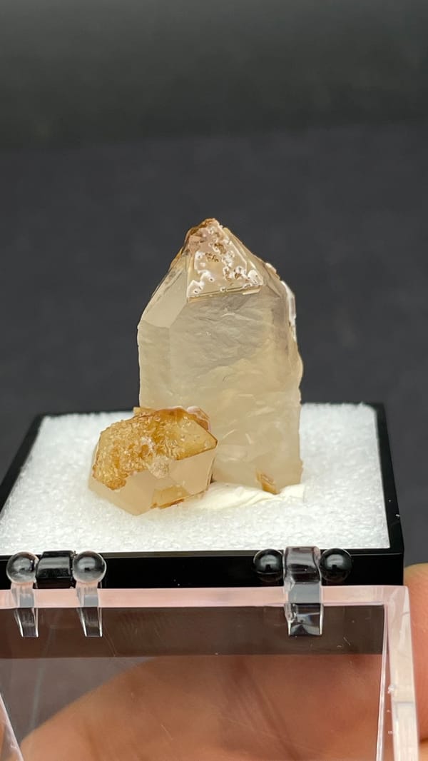 Caramel-brown frosted quartz crystal from Jinlong, Guangdong, China, in a box, reverse side