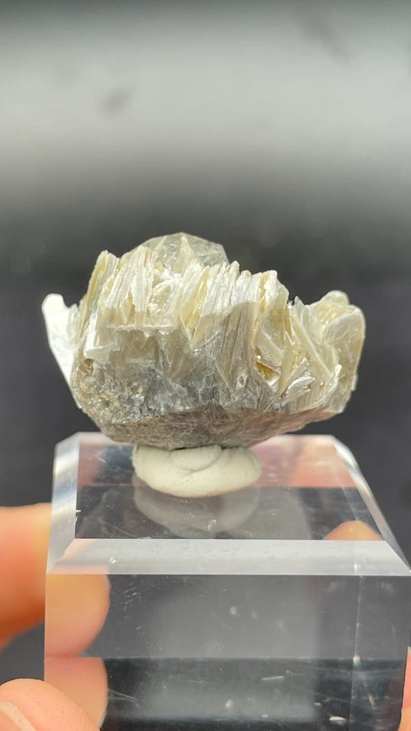 Pale aquamarine among yellow-green mica books, Xuebaoding, Sichuan, China, detail of the matrix contact
