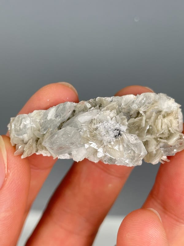 Pale aquamarine crystals in a white mica and quartz plate, Xuebaoding, Sichuan, reverse side