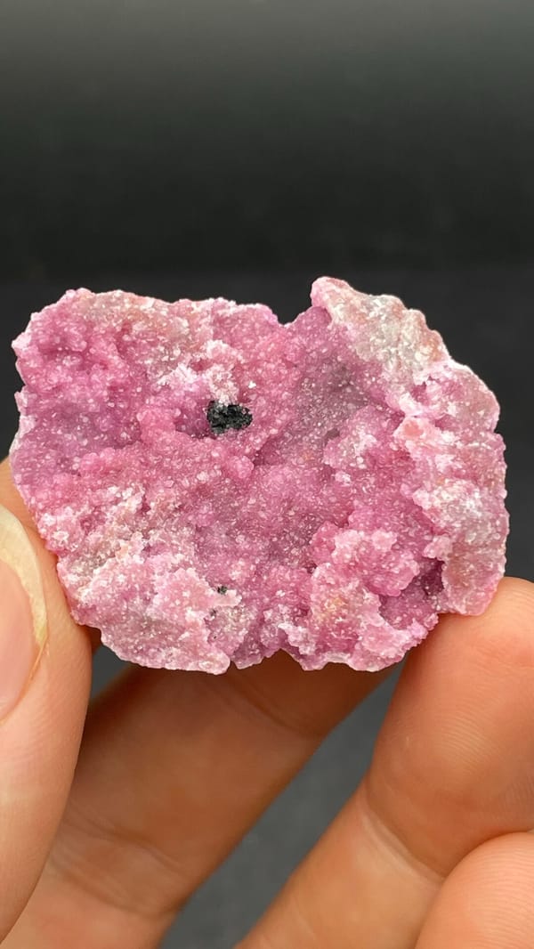 Bright rose-pink cobaltoan calcite crust from DR Congo, top view