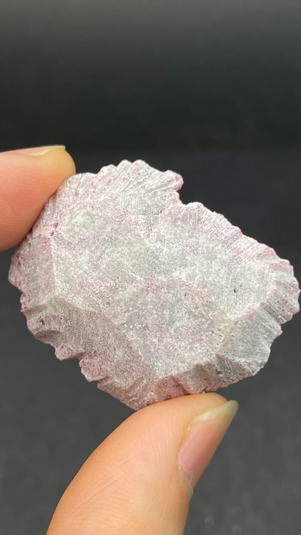 Bright rose-pink cobaltoan calcite crust from DR Congo, detail of the matrix contact