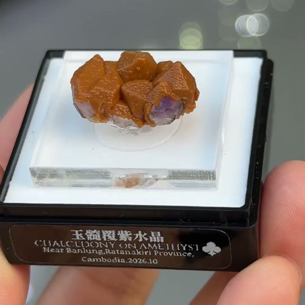 Amethyst points coated in orange chalcedony from Ratanakiri, Cambodia — detail view