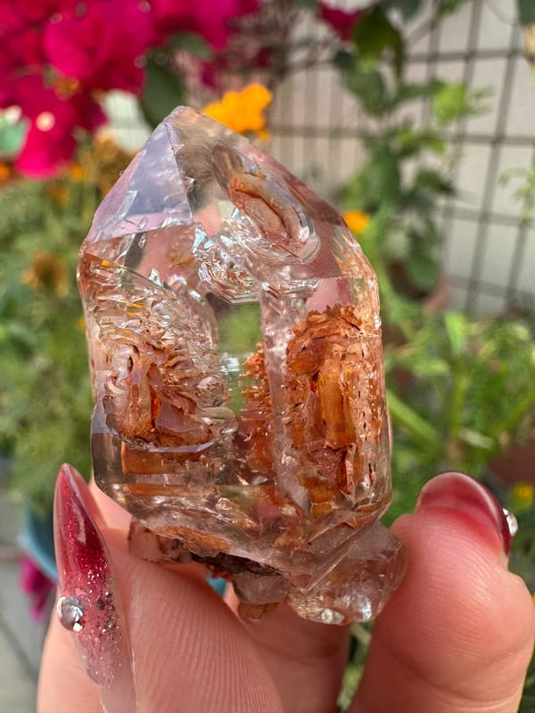 Transparent skeletal quartz with rust-red material from Namibia, specimen view 1