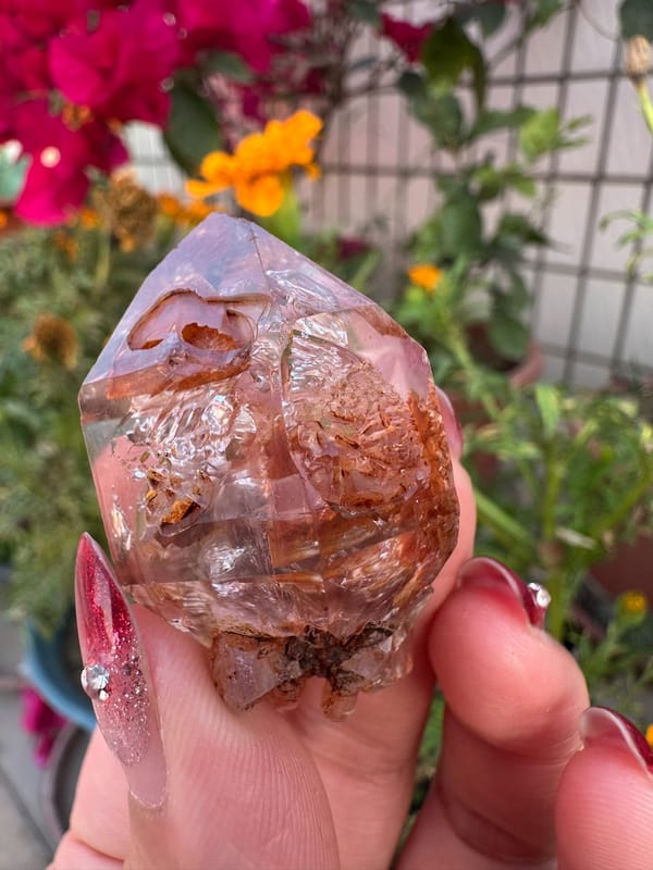 Transparent skeletal quartz with rust-red material from Namibia, specimen view 2