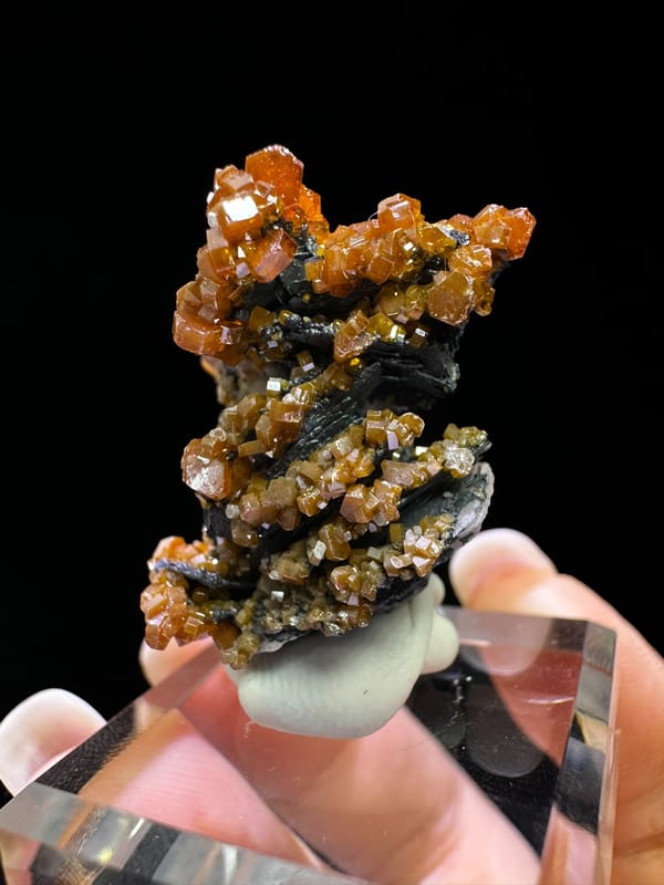 Orange Vanadinite on Black Baryte Matrix