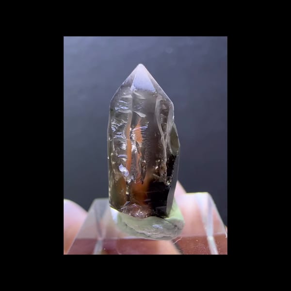 Skeletal smoky quartz with red inclusions from Madagascar — complete front view