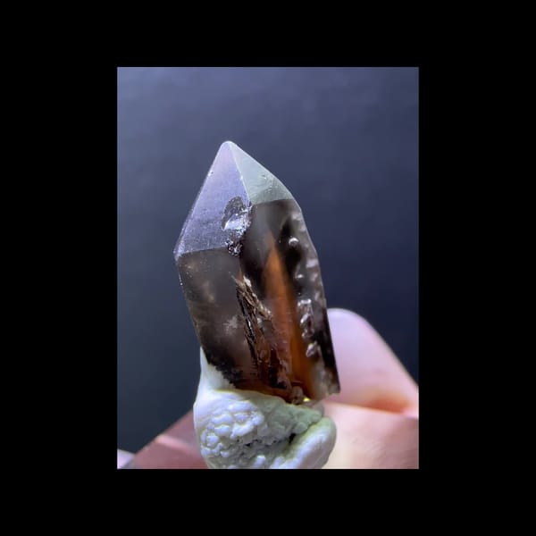 Skeletal smoky quartz with red inclusions from Madagascar — alternate side view