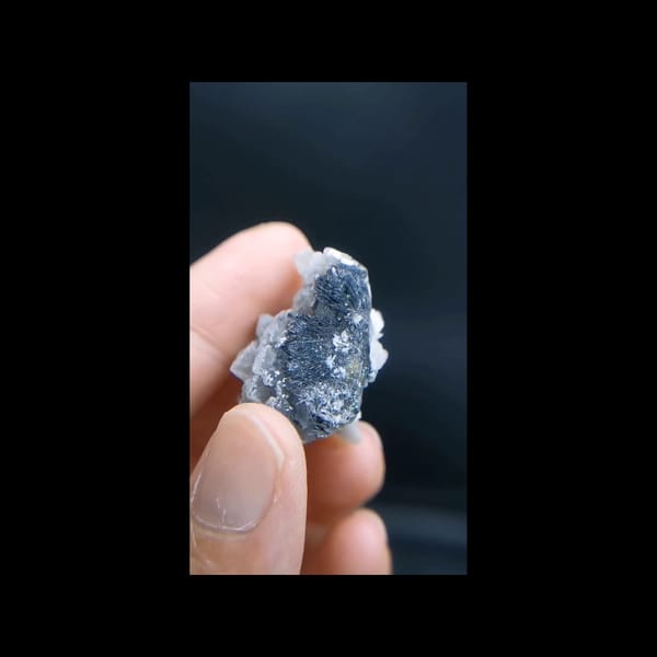 Rose-like calcite with specular hematite from Inner Mongolia — additional angle
