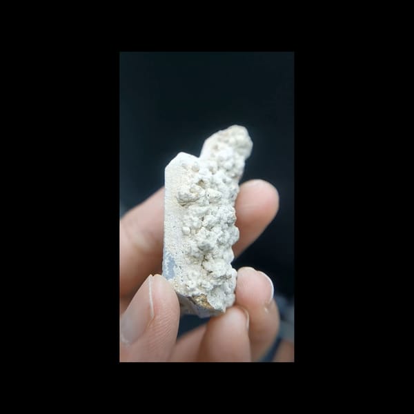 Pale quartz with calcite crust from Inner Mongolia — alternate side view