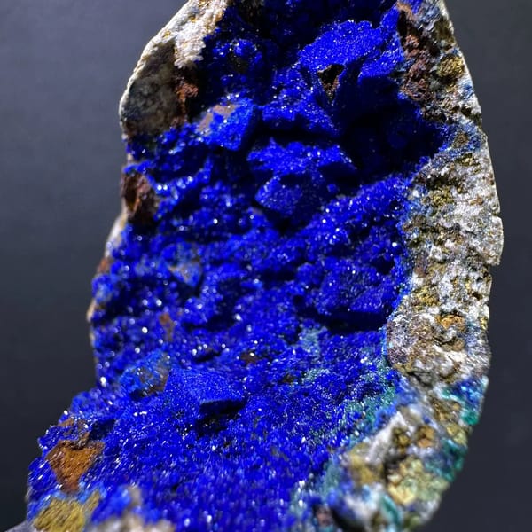 Royal-blue azurite crystals filling a siderite pocket from Yunnan — complete view
