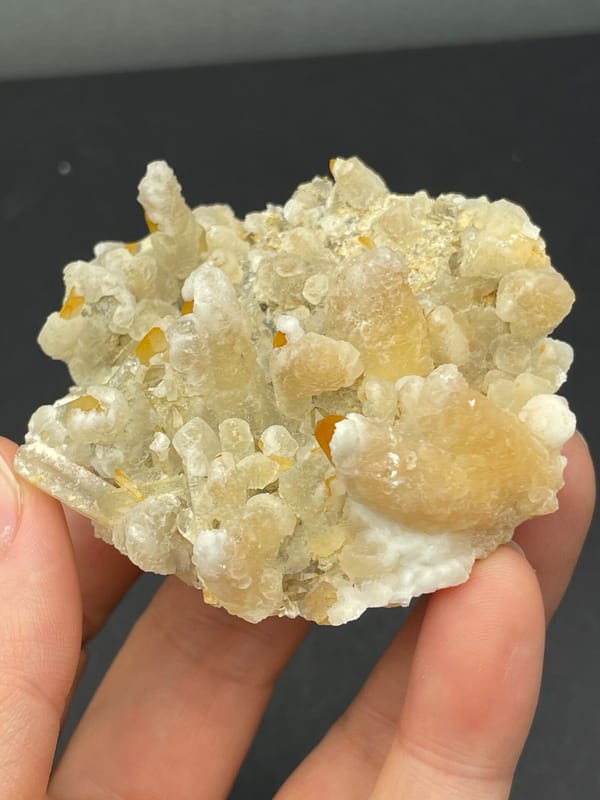 Cream-yellow citrine and calcite crust from Jinkouhe, Sichuan, China, reverse side