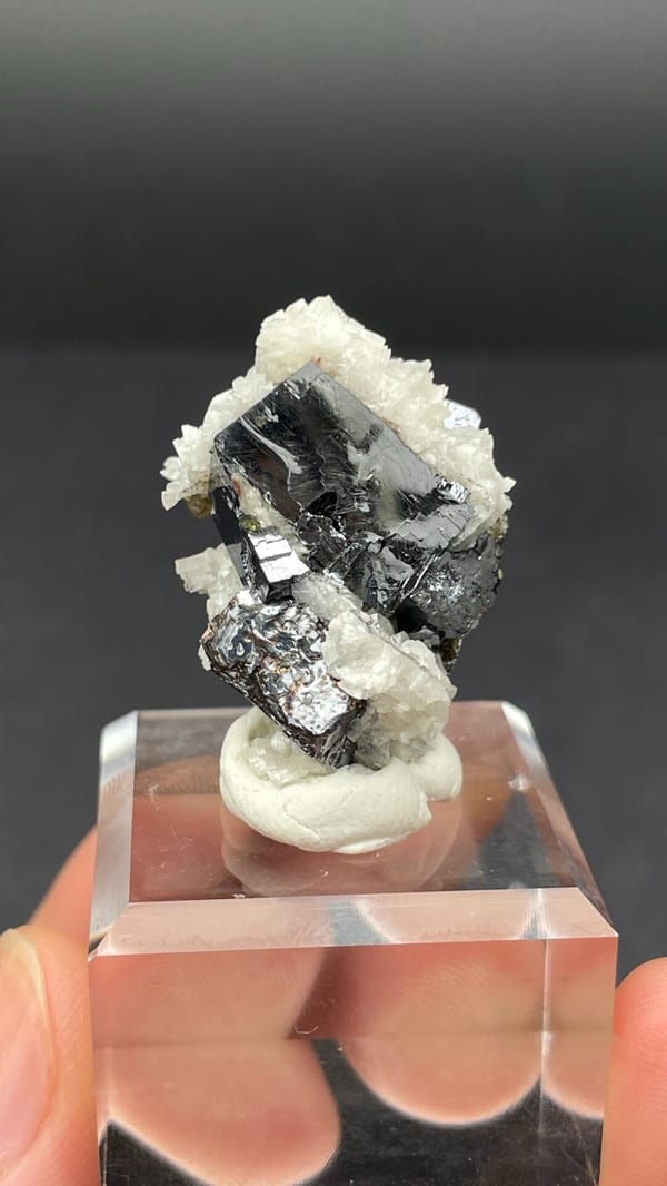 Metallic galena crystal in white dolomite crust from Jiangxi, China, on a stand
