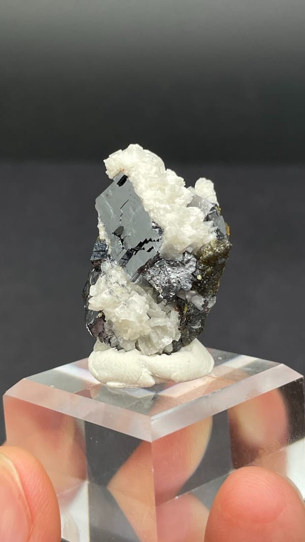 Metallic galena crystal in white dolomite crust from Jiangxi, China, close-up of the crystal faces