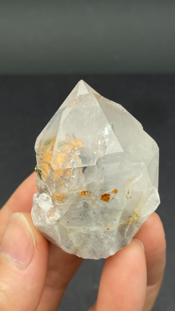 Garden quartz crystal with green epidote inclusions from Meigu, Sichuan, China, reverse side