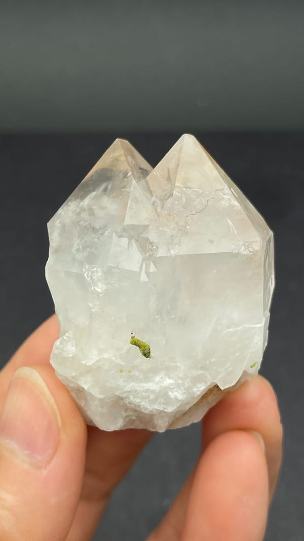 Garden quartz crystal with green epidote inclusions from Meigu, Sichuan, China, top view