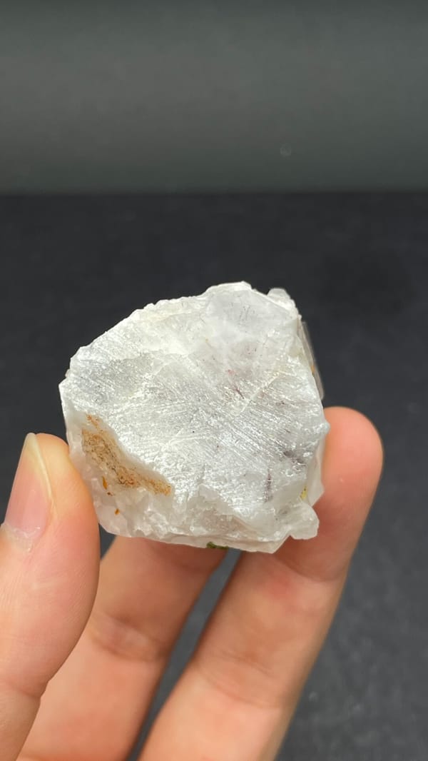 Garden quartz crystal with green epidote inclusions from Meigu, Sichuan, China, detail of the matrix contact